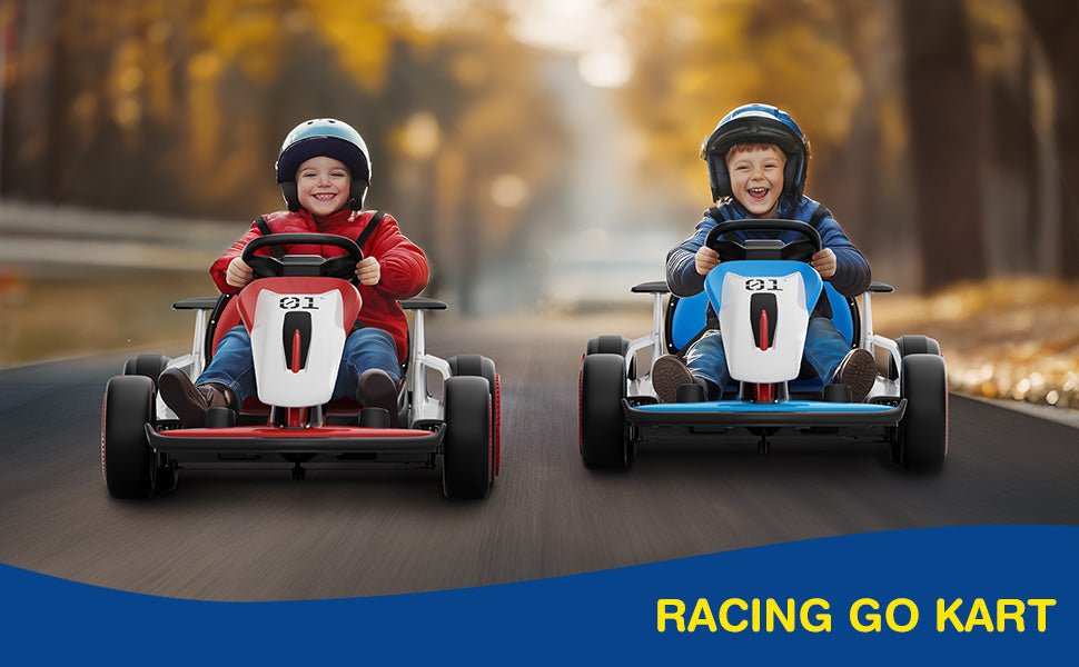 Two children in racing go karts on a road with blurred trees in the background